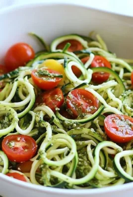 Raw Spiralized Zucchini Noodles with Tomatoes and Pesto