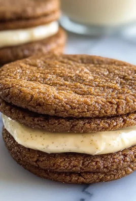 Ginger Molasses Sandwich Cookies with Eggnog Frostings